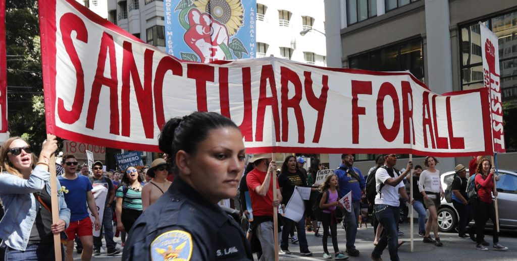 protesta marcha inmigrantes santuario